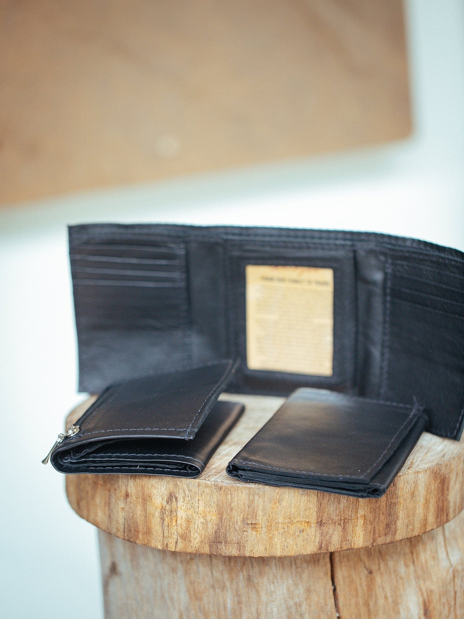 Mens trifold wallet with coin outlet pocket